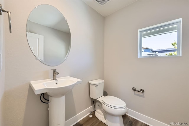 858 Promenade Dr, Superior, CO 80027 - half bath featuring baseboards, toilet, and wood finished floors