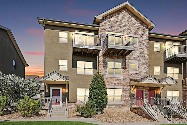 view of property with a balcony