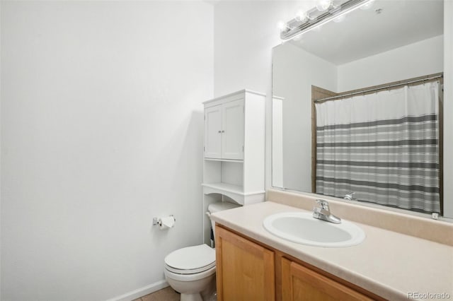 bathroom featuring toilet, vanity, and a shower with shower curtain