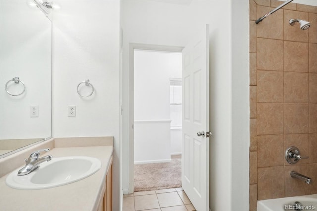 bathroom featuring vanity, tiled shower / bath, and tile patterned floors