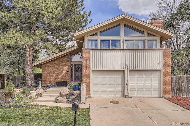 mid-century inspired home featuring brick siding, driveway, fence, and a chimney