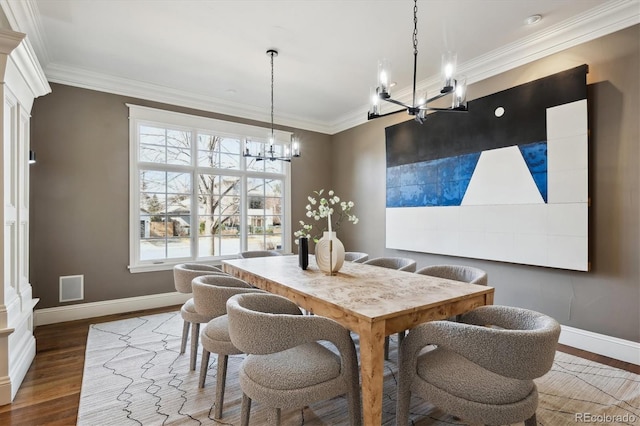 dining area featuring ornamental molding, dark wood finished floors, and baseboards