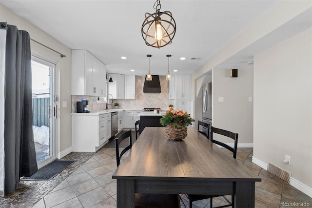 dining area with light tile patterned floors, baseboards, visible vents, and recessed lighting