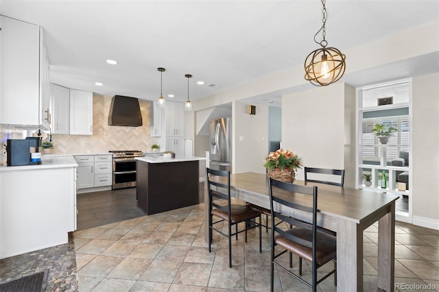 dining area featuring recessed lighting