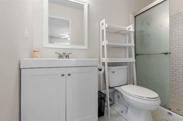 full bath with tile patterned floors, a shower stall, toilet, and vanity