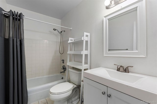 bathroom featuring toilet, shower / bath combo with shower curtain, and vanity