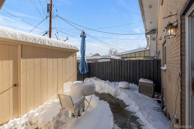 view of yard featuring central AC unit and fence