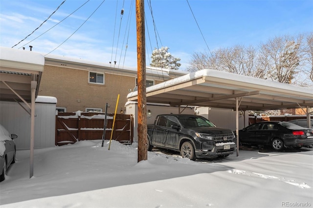 view of parking / parking lot featuring fence