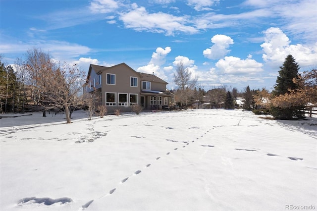 view of snow covered property