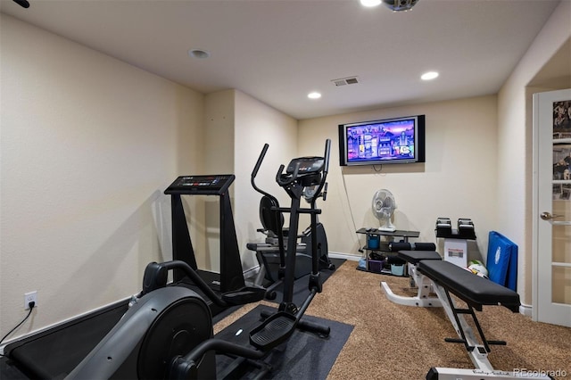 workout room featuring carpet