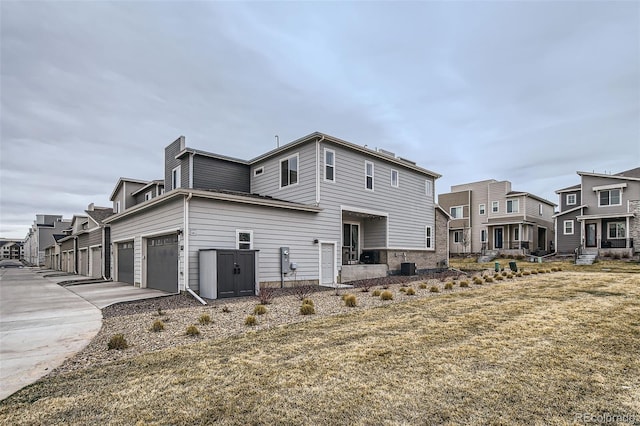 12345 Festival Ln, Thornton, CO 80241 - back of house with a residential view and driveway