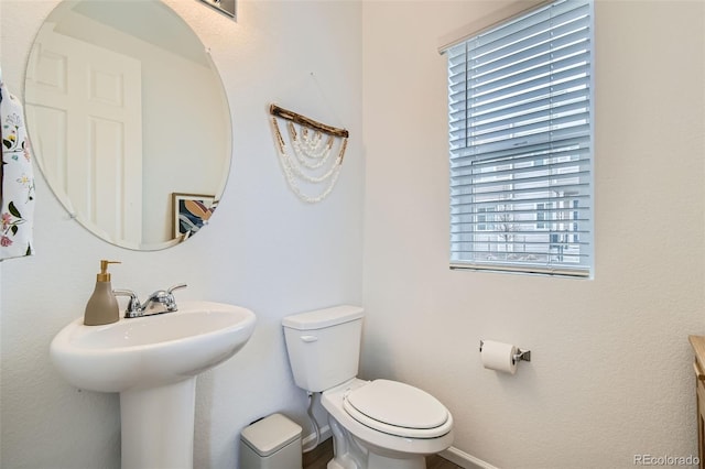 12345 Festival Ln, Thornton, CO 80241 - half bath featuring toilet and baseboards