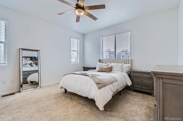12345 Festival Ln, Thornton, CO 80241 - bedroom with light colored carpet and a ceiling fan