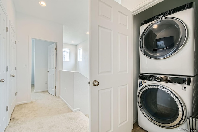 12345 Festival Ln, Thornton, CO 80241 - laundry area with stacked washer / drying machine, carpet, and recessed lighting