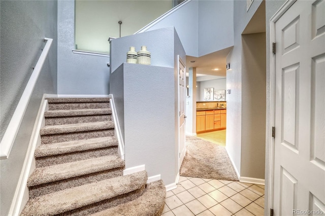 23070 York Ave, Parker, CO 80138 - stairs with tile patterned floors, baseboards, and carpet floors