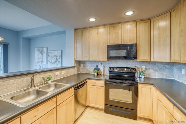 23070 York Ave, Parker, CO 80138 - kitchen with black appliances, light brown cabinetry, a sink, dark countertops, and recessed lighting