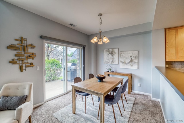 23070 York Ave, Parker, CO 80138 - dining space with light colored carpet, a chandelier, and baseboards