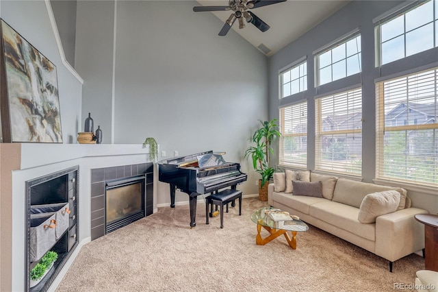 23070 York Ave, Parker, CO 80138 - carpeted living area featuring a fireplace, high vaulted ceiling, ceiling fan, and baseboards