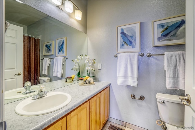 23070 York Ave, Parker, CO 80138 - full bathroom with toilet, vanity, tile patterned flooring, a textured wall, and a shower with curtain