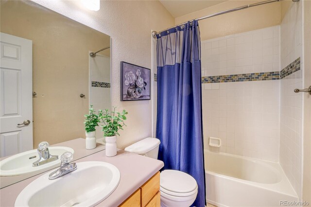 23070 York Ave, Parker, CO 80138 - bathroom featuring vanity, toilet, shower / bath combo with shower curtain, and a textured wall