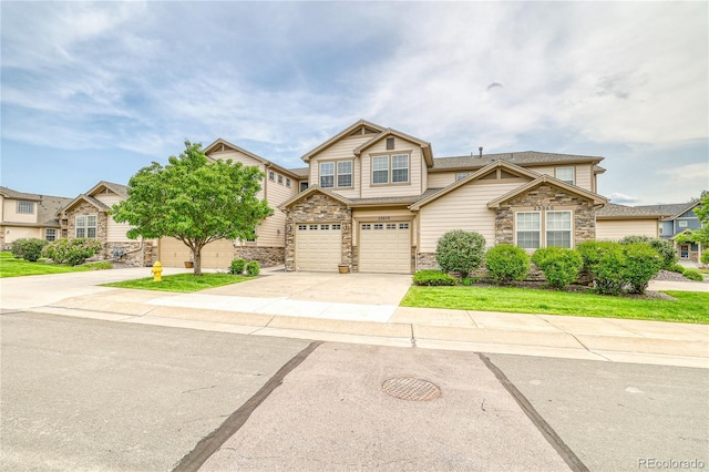 23070 York Ave, Parker, CO 80138 - view of front of property with stone siding, concrete driveway, and a garage