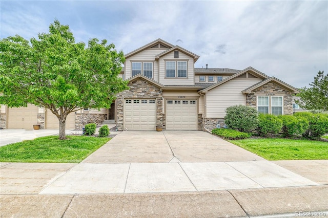 23070 York Ave, Parker, CO 80138 - craftsman inspired home with stone siding, driveway, and an attached garage