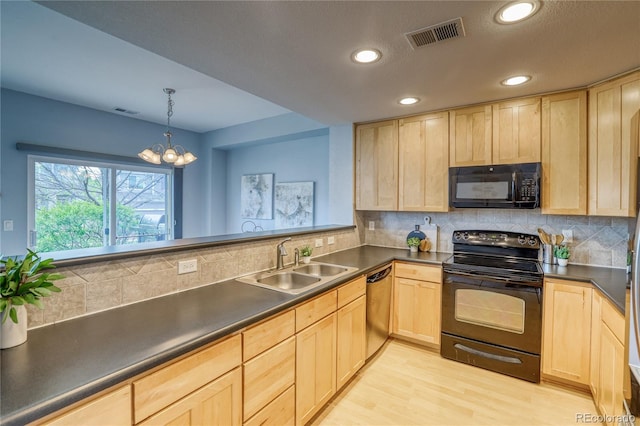 23070 York Ave, Parker, CO 80138 - kitchen featuring black appliances, light brown cabinetry, a sink, dark countertops, and recessed lighting