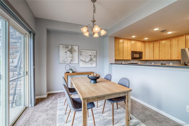 23070 York Ave, Parker, CO 80138 - dining area with light carpet, baseboards, a chandelier, and recessed lighting