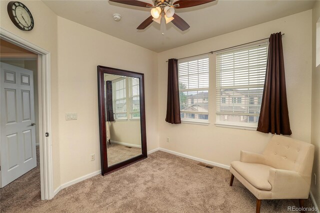 23070 York Ave, Parker, CO 80138 - living area with light carpet, ceiling fan, and baseboards