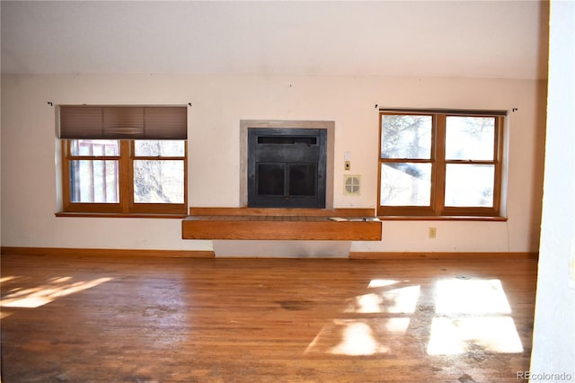 unfurnished living room with hardwood / wood-style floors