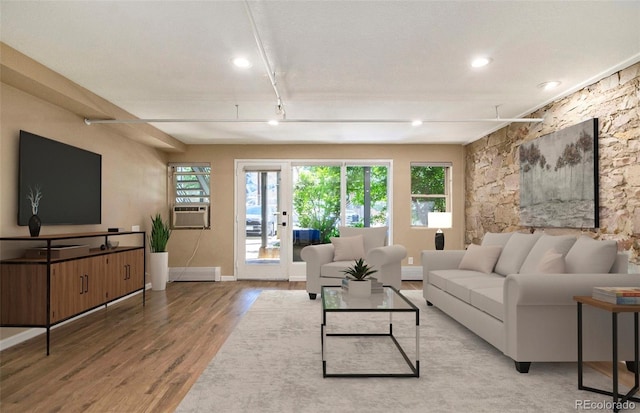 living room with wood-type flooring and cooling unit