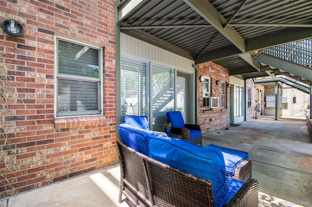 view of patio / terrace with cooling unit and an outdoor living space