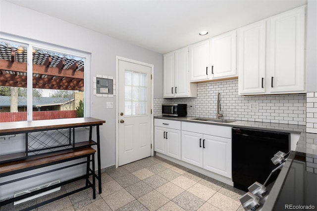 kitchen featuring a sink, black dishwasher, plenty of natural light, stainless steel microwave, and recessed lighting