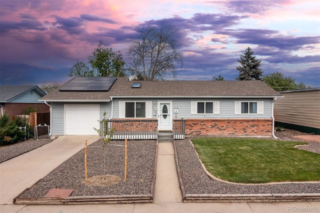 7286 Wolff St, Westminster, CO 80030 - single story home with driveway, a garage, brick siding, solar panels, and a gate