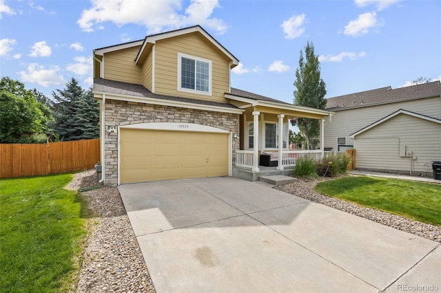 10530 Mount Columbia Pl, Parker, CO 80138 - view of front of home featuring covered porch, driveway, stone siding, and an attached garage