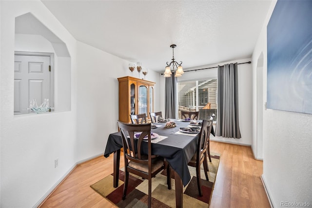 10530 Mount Columbia Pl, Parker, CO 80138 - dining area with a chandelier and light wood-style flooring