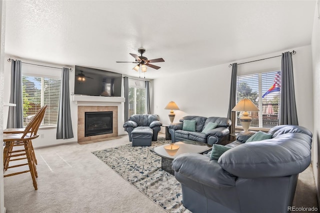 10530 Mount Columbia Pl, Parker, CO 80138 - carpeted living room with healthy amount of natural light, ceiling fan, and a tile fireplace