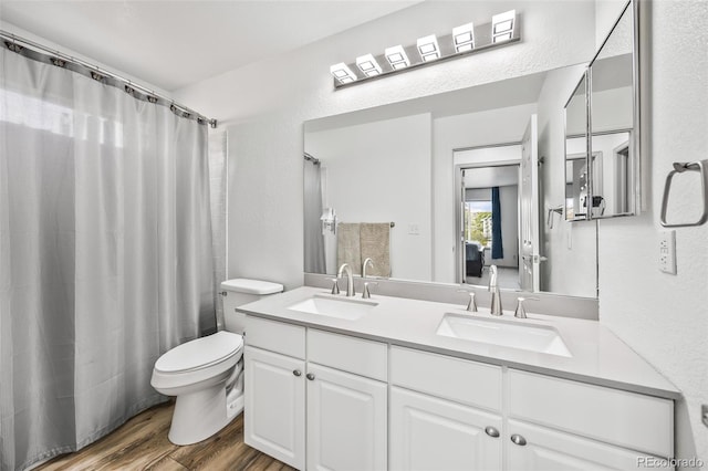 10530 Mount Columbia Pl, Parker, CO 80138 - bathroom featuring double vanity, wood finished floors, and a shower with curtain