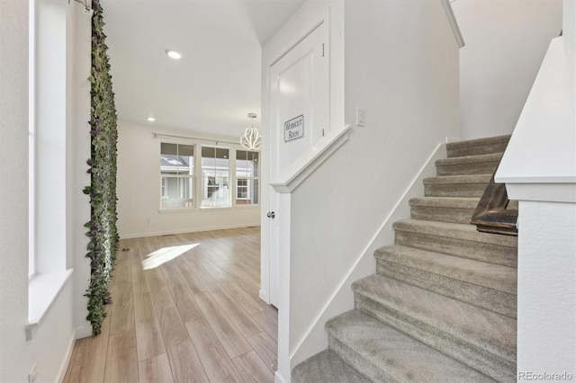 staircase featuring hardwood / wood-style flooring