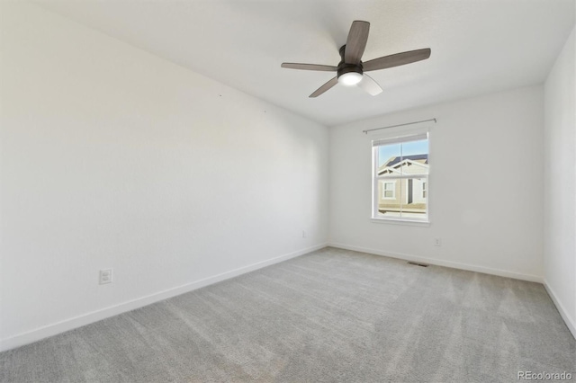 carpeted empty room with ceiling fan