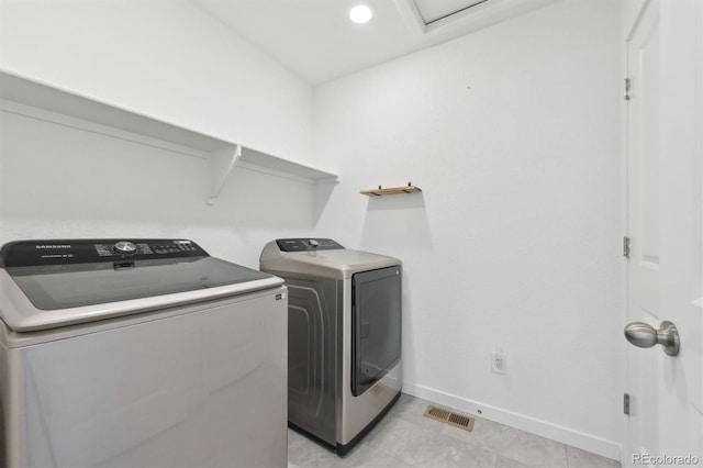 laundry room featuring washer and clothes dryer