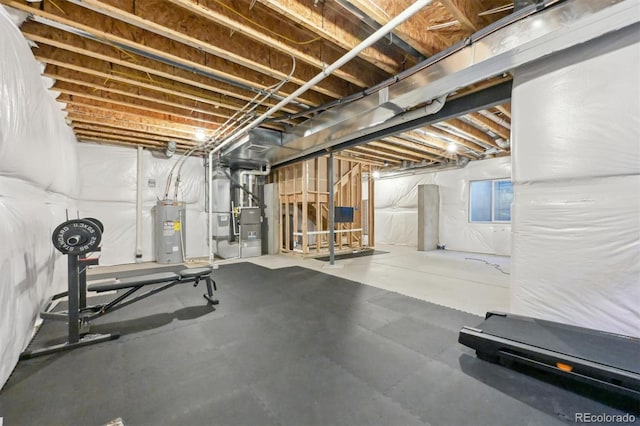 workout room with electric water heater and heating unit