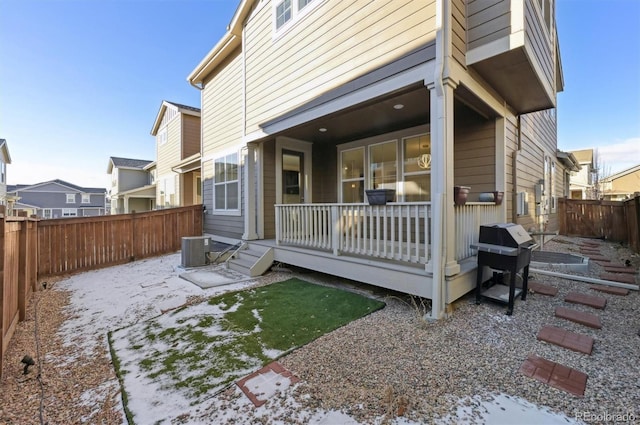 back of property featuring central AC unit