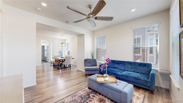 14074 Jackson St, Thornton, CO 80602 - living room with wood finished floors, a ceiling fan, and recessed lighting
