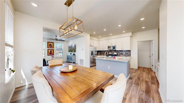 14074 Jackson St, Thornton, CO 80602 - dining space featuring ceiling fan, a chandelier, light wood-style floors, and recessed lighting