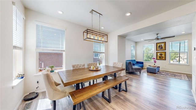 14074 Jackson St, Thornton, CO 80602 - dining room with light wood finished floors and recessed lighting