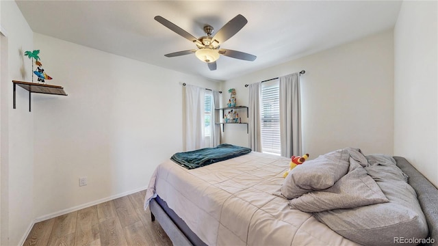 14074 Jackson St, Thornton, CO 80602 - bedroom with light wood finished floors and a ceiling fan