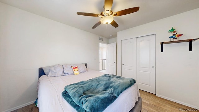 14074 Jackson St, Thornton, CO 80602 - bedroom with light wood finished floors, a closet, and ceiling fan
