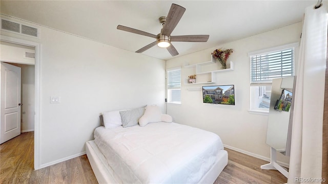 14074 Jackson St, Thornton, CO 80602 - bedroom with wood finished floors and ceiling fan