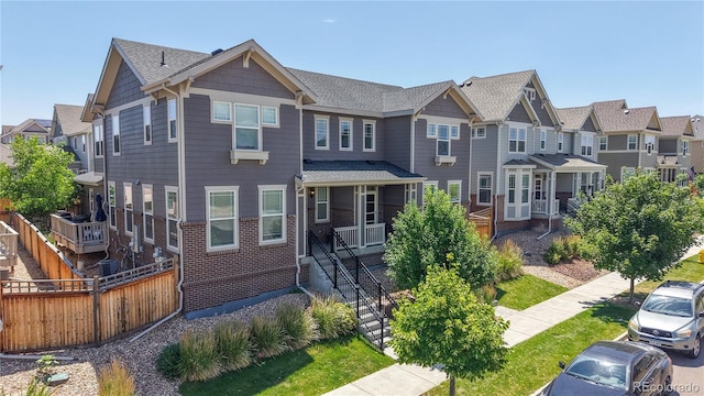 14074 Jackson St, Thornton, CO 80602 - view of property featuring a residential view and brick siding